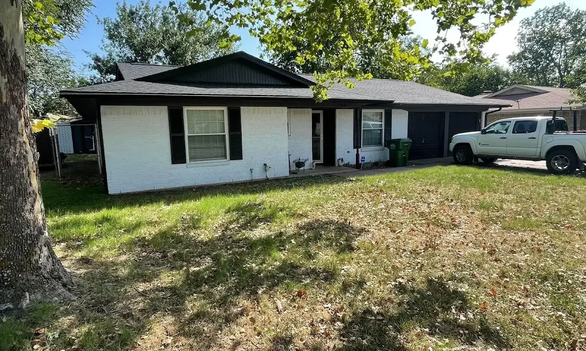 Professional roofing crew working on a residential roof in Southborough